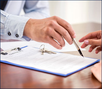 Woman Signing a Contract